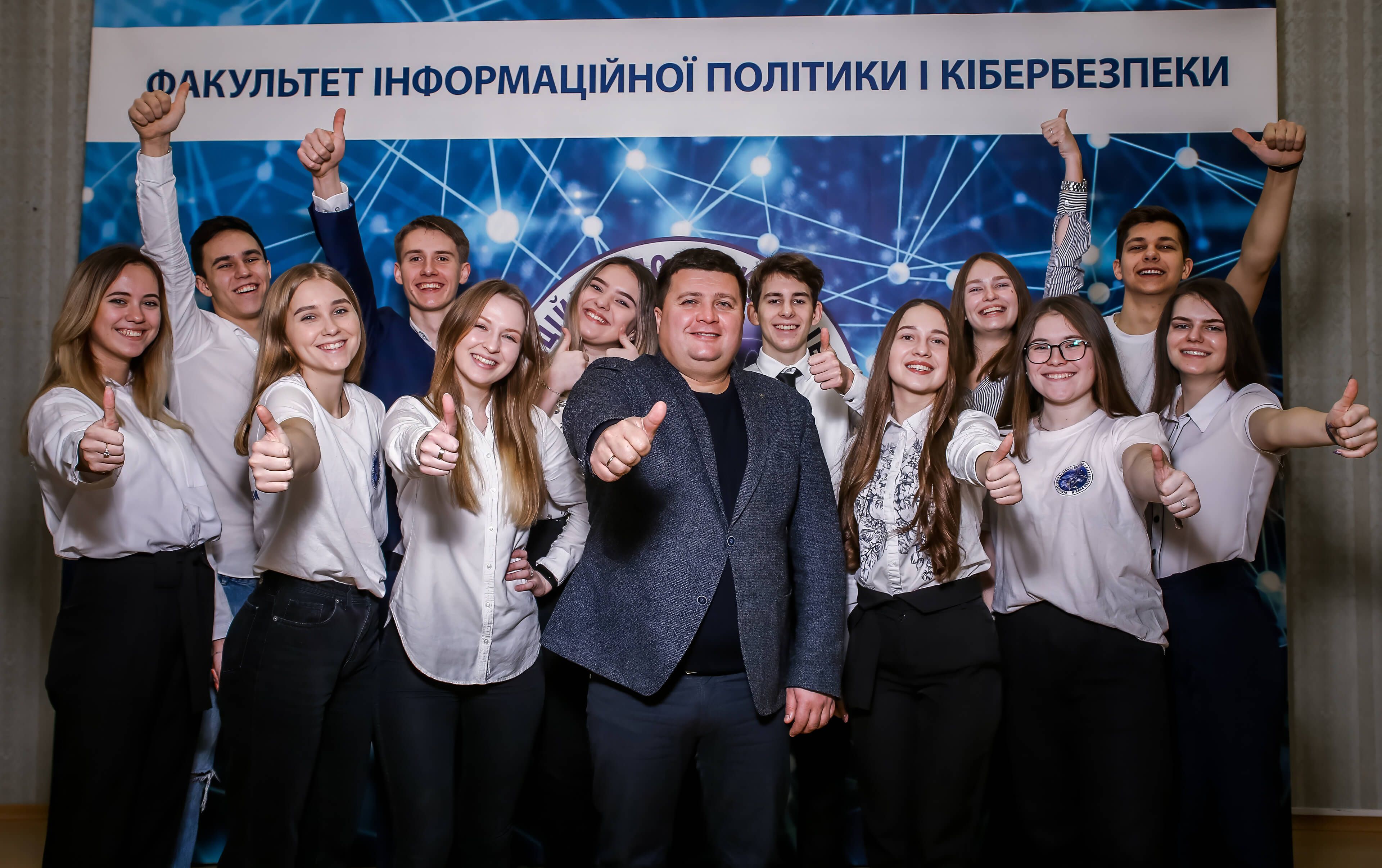 dean of the Faculty of information policy and cybersecurity Valery Volodymyrovych Kushnaryov with students